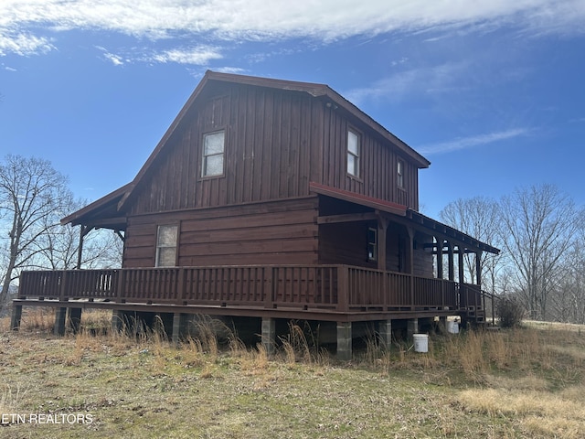 view of side of property with a deck