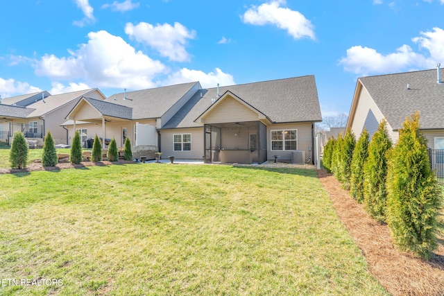 back of house featuring a yard, central AC, a patio area, and a fenced backyard