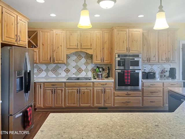 kitchen featuring pendant lighting, appliances with stainless steel finishes, light brown cabinetry, and backsplash