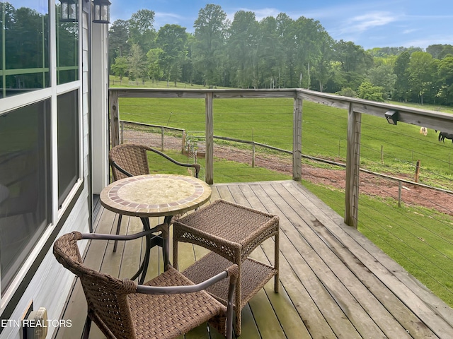 deck featuring a lawn