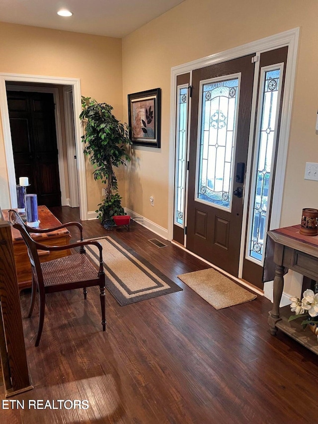 entryway with hardwood / wood-style flooring