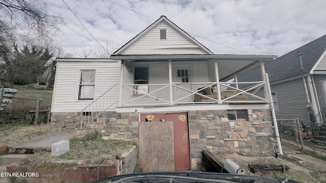 view of front of house featuring a balcony