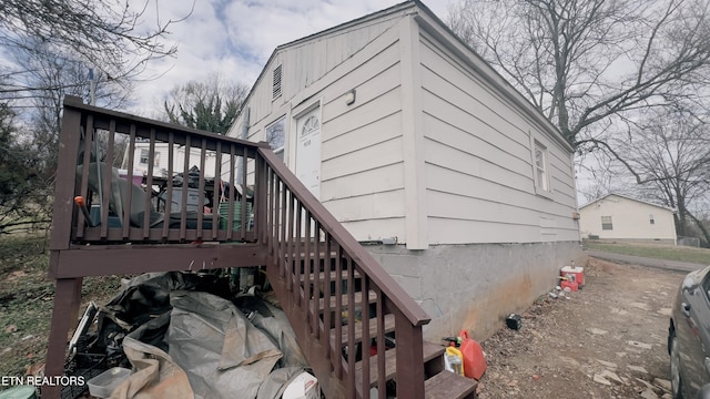 view of side of property featuring a deck