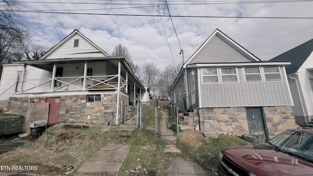 view of front of property with a balcony