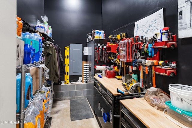 interior space with a workshop area and concrete flooring