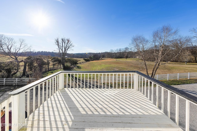 wooden deck featuring a rural view