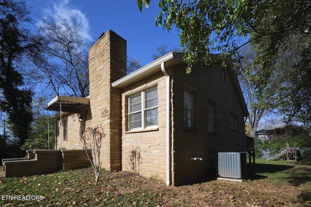 view of home's exterior with central air condition unit