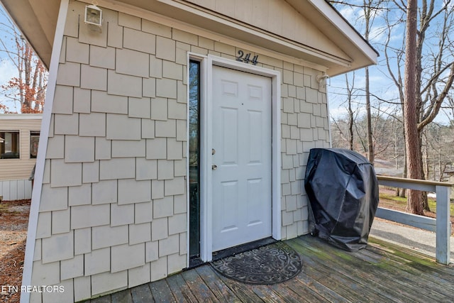 entrance to property with a wooden deck