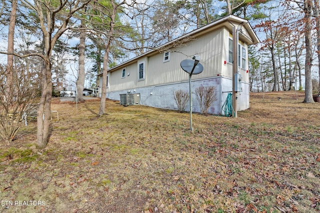 view of side of property featuring central AC unit