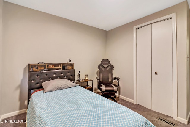 carpeted bedroom featuring a closet