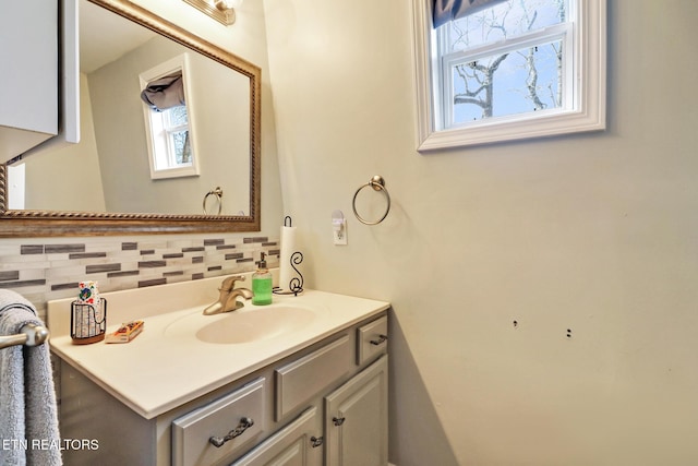 bathroom with vanity and backsplash