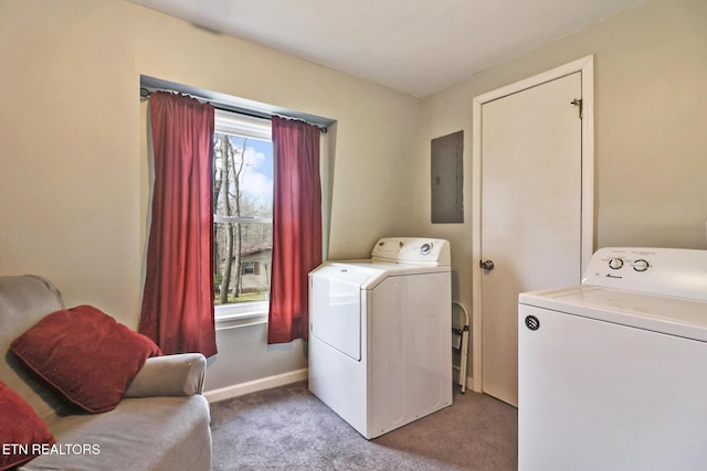 clothes washing area featuring carpet floors, washing machine and clothes dryer, and electric panel