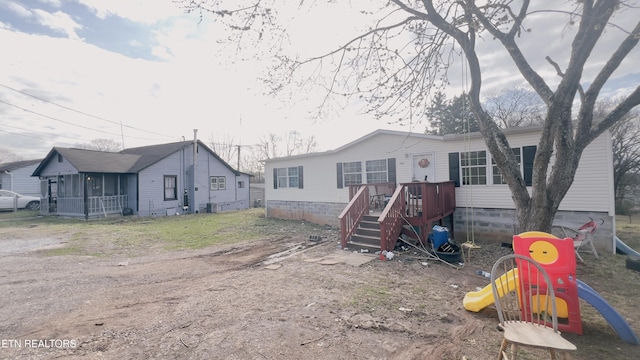 view of front of home with a playground