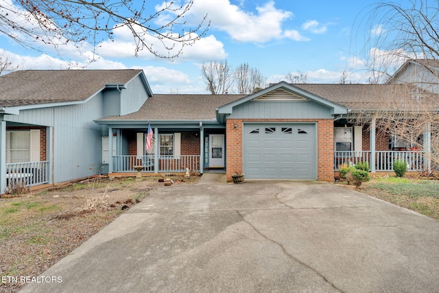 ranch-style home with a garage and covered porch