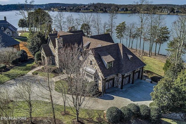 birds eye view of property featuring a water view