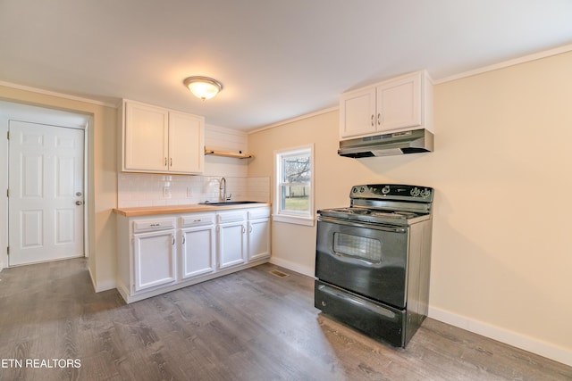 kitchen with sink, white cabinets, decorative backsplash, black range with electric stovetop, and light wood-type flooring