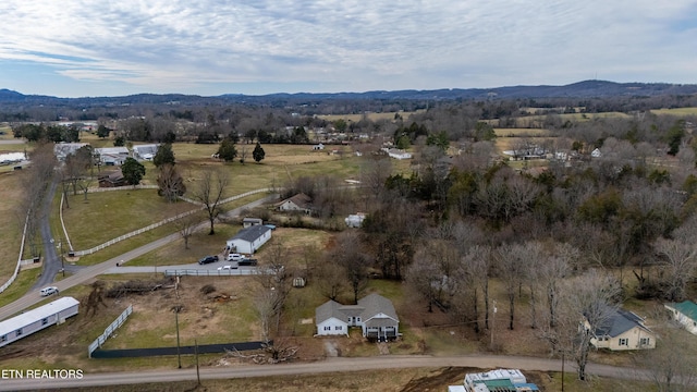 birds eye view of property with a mountain view