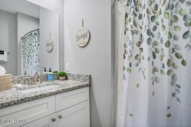 bathroom featuring vanity and a shower with curtain