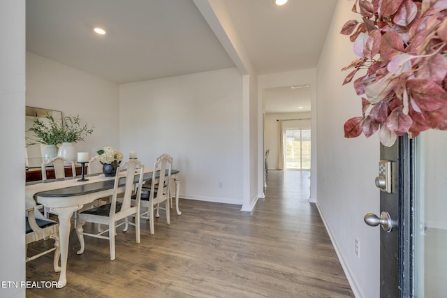 dining area with dark hardwood / wood-style floors