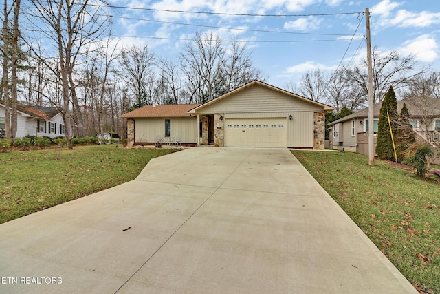 ranch-style house featuring a front yard, stone siding, driveway, and an attached garage