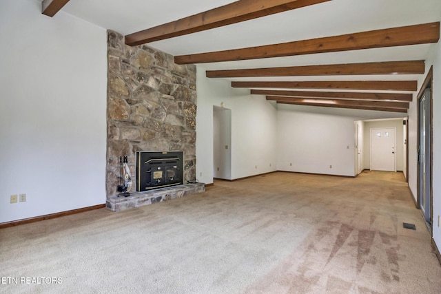 unfurnished living room featuring light carpet, beamed ceiling, visible vents, and baseboards