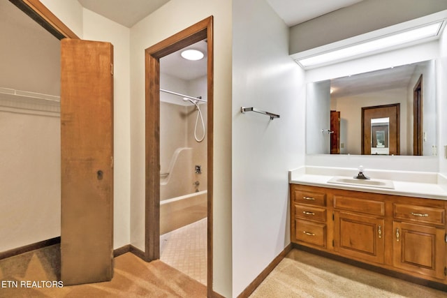 bathroom with washtub / shower combination, baseboards, and vanity