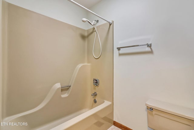 bathroom featuring toilet and shower / bathtub combination