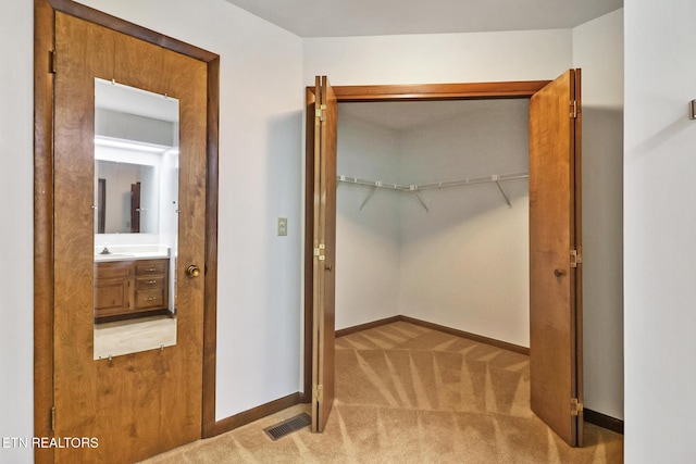 closet featuring a sink and visible vents