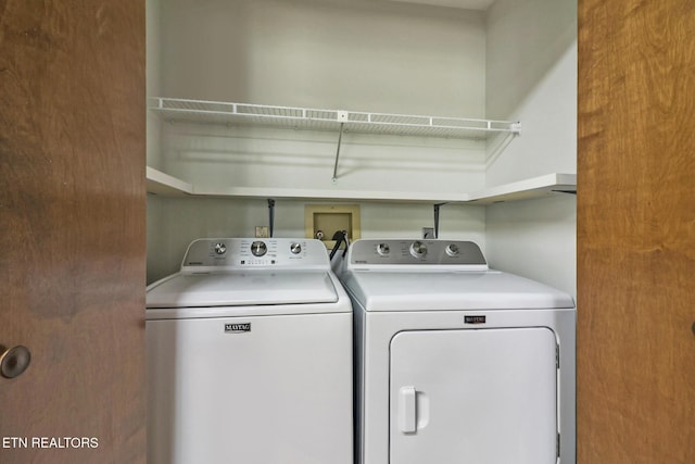 laundry area featuring laundry area and washing machine and clothes dryer