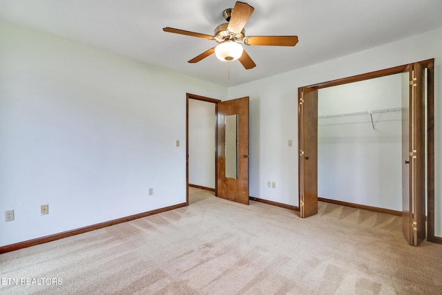 unfurnished bedroom featuring a ceiling fan, a closet, light carpet, and baseboards