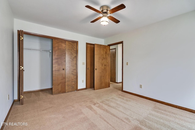 unfurnished bedroom with light carpet, ceiling fan, and baseboards