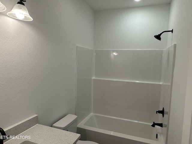 full bathroom with vanity, shower / tub combination, and toilet