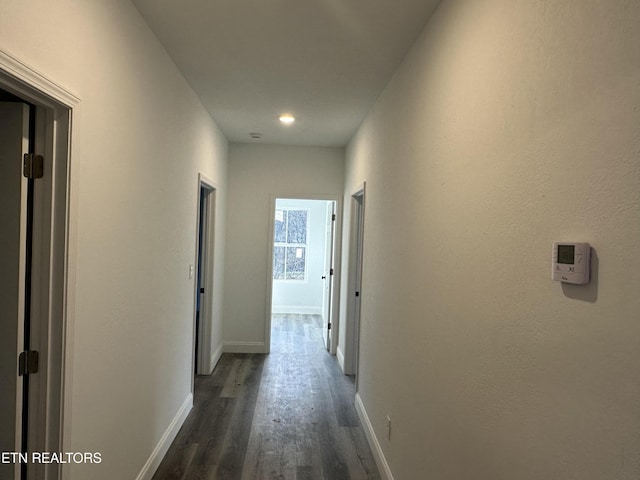 hallway featuring dark hardwood / wood-style floors