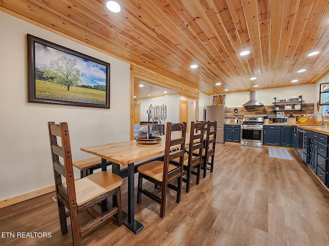 dining room with recessed lighting, wooden ceiling, light wood-type flooring, and baseboards