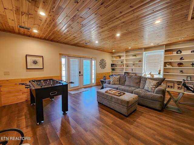 game room with built in features, visible vents, wood ceiling, french doors, and wainscoting
