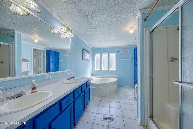 bathroom with plus walk in shower, ornamental molding, vanity, tile patterned floors, and a textured ceiling