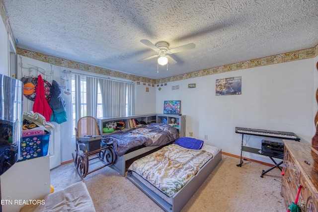 bedroom featuring ceiling fan and a textured ceiling