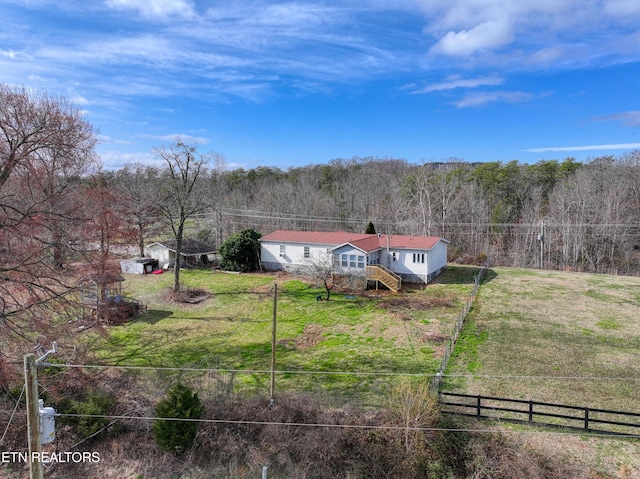 birds eye view of property with a rural view