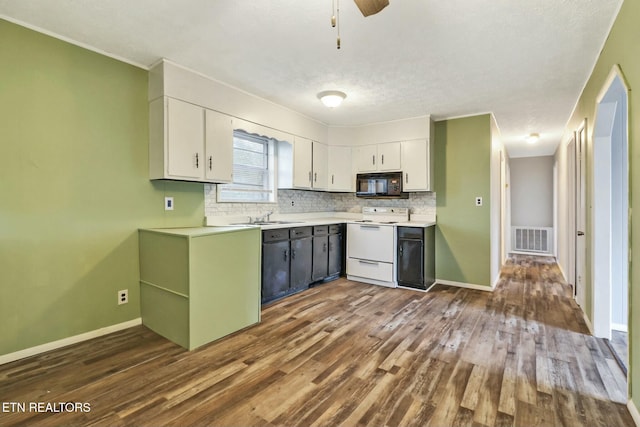 kitchen featuring backsplash, white electric range, and white cabinets