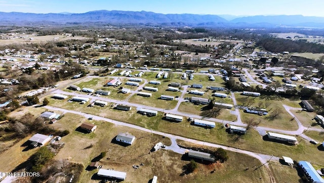 birds eye view of property with a mountain view