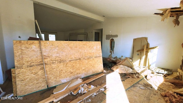 miscellaneous room featuring lofted ceiling with beams