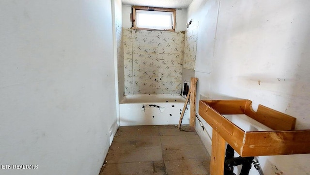 bathroom with a washtub