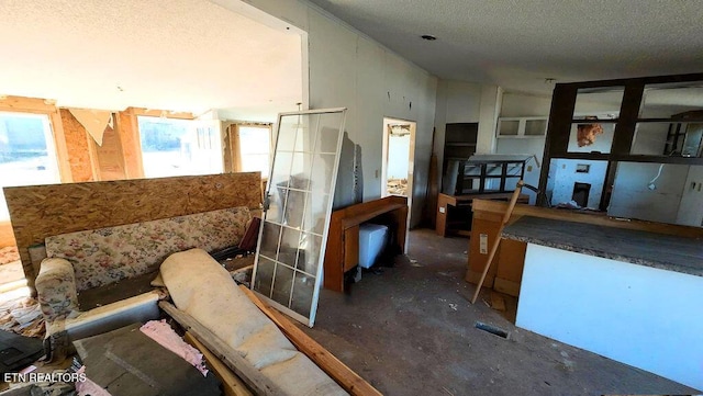 miscellaneous room with a textured ceiling