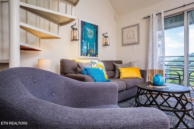 living area with ornamental molding and plenty of natural light