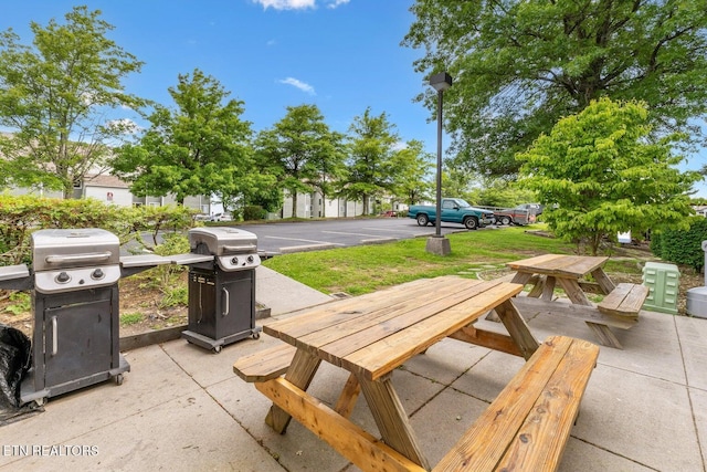 view of patio featuring area for grilling and outdoor dining area