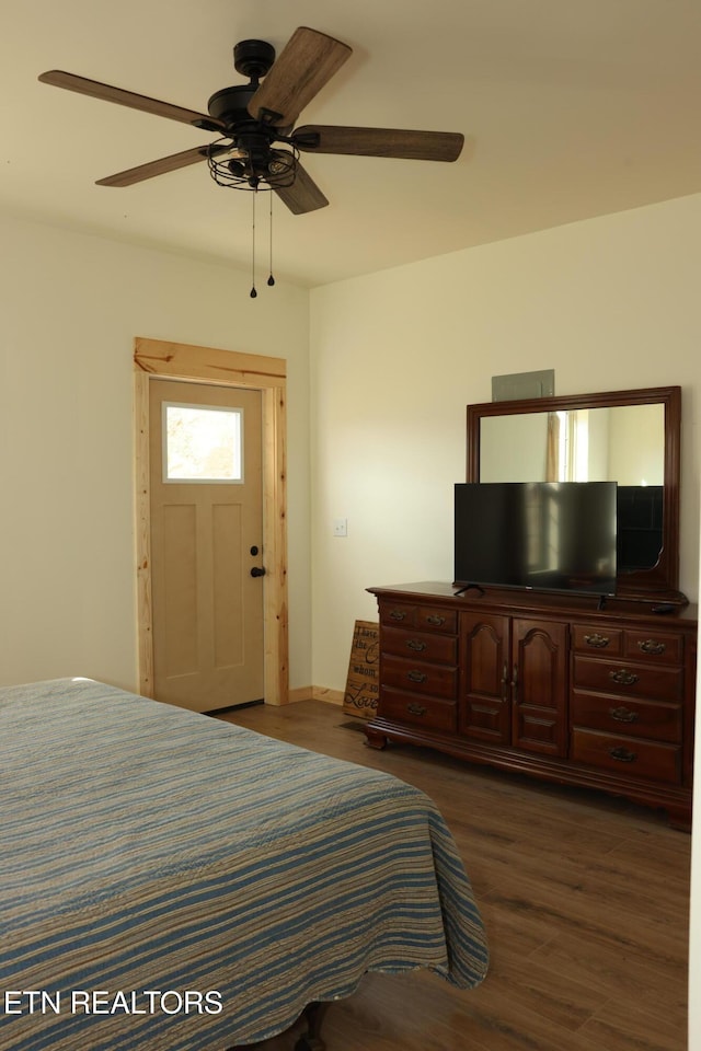 bedroom featuring ceiling fan and dark hardwood / wood-style flooring