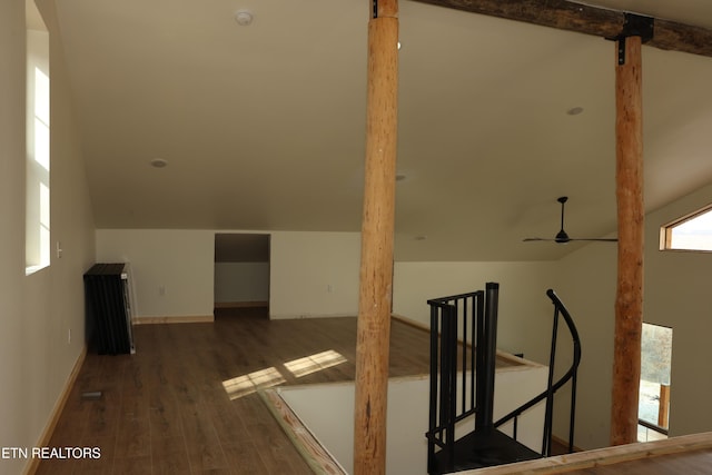 bonus room featuring ceiling fan, lofted ceiling, and dark hardwood / wood-style floors