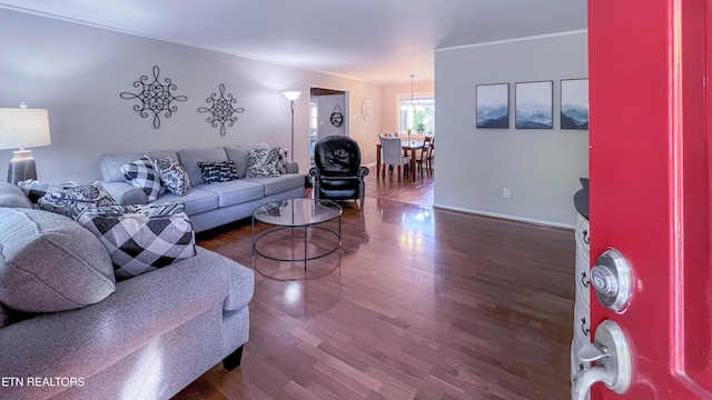 living room featuring ornamental molding and hardwood / wood-style floors