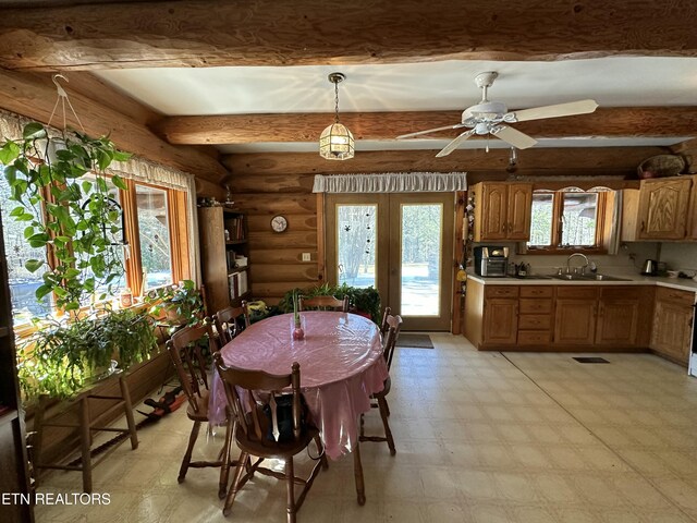 dining space featuring beam ceiling, log walls, light floors, visible vents, and ceiling fan