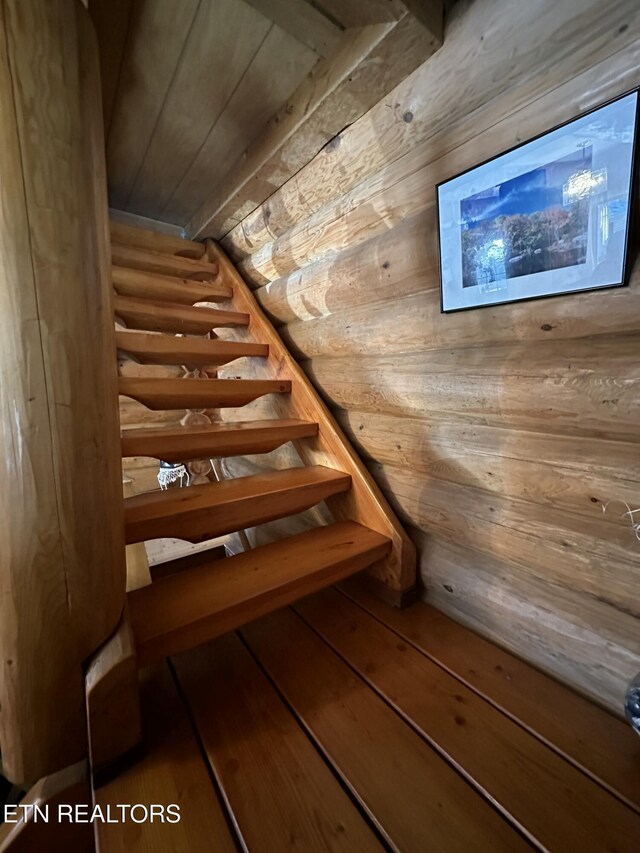 stairway with wooden walls